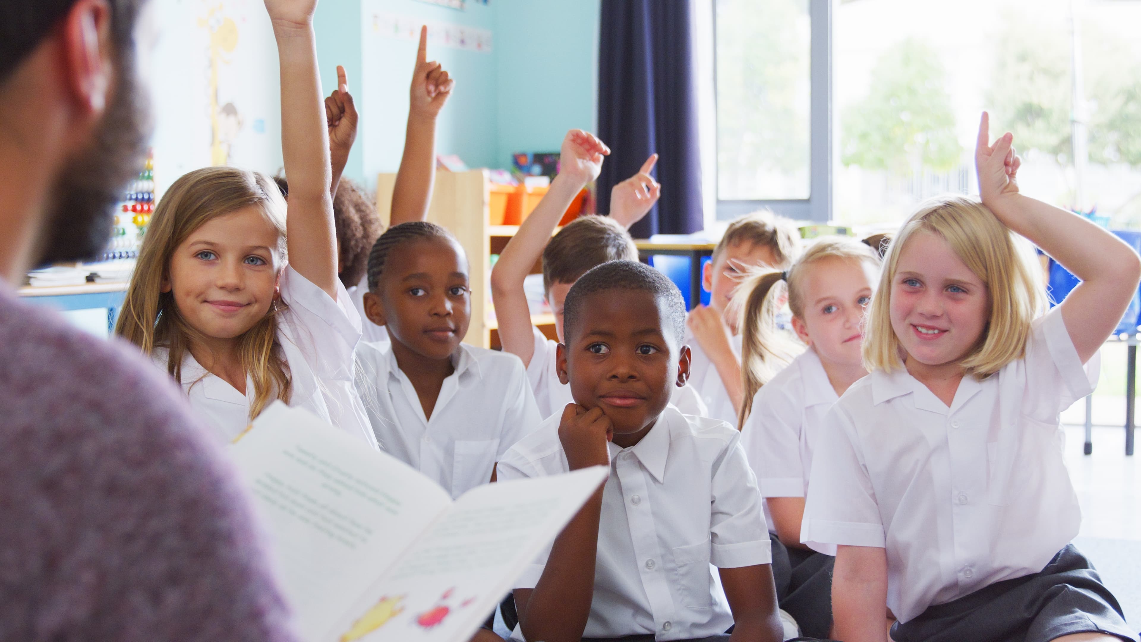 Students reading in a classroom setting.